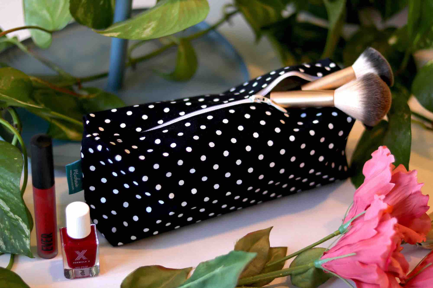 Single polka dot clutch bag